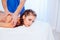 Girl masseur doing massage back spa health