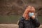 Girl with medical mask coughing. Mask to protect her from virus .Woman with mask for Coronavis. People cough, being hospitalized,