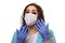 A girl in a medical mask, gloves and a robe on a white background. Beautician, beauty specialist. White-blue tones photo