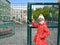 A girl in a medical mask stands near a locked playground. The coronavirus epidemic is COVID-19 in Russia. Kaliningrad
