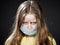 Girl in a medical protective mask. Coronavirus epidemic. Conceptual image. Stop the virus. Protective equipment