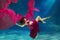 Girl mermaid. Underwater scene. A woman, a fashion model in the