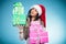 Girl mixed race santa claus hat with gift boxes