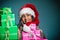 Girl mixed race santa claus hat with gift boxes