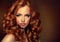 Girl model with long curly red hair.