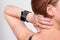 Girl with a modern Internet Smart Watch on grey background