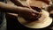 Girl moistening hands in pottery. Woman getting ready for handmade process