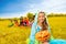 Girl in monster costume holds Halloween pumpkin