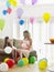 Girl And Mother In Room Full Of Balloons