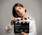 Girl with movie clapper board