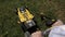 Girl mowing the lawn with the mower, the view from the top. close up