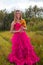 Girl muddy prom dress holding flowers