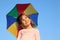 Girl with multicolor rainbow umbrella