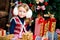 The girl near a Christmas fir-tree in red tones