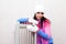 Girl  near a radiator heated