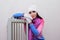 Girl near a radiator heated