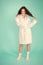 Girl no makeup face long hair wear bathrobe turquoise background. Ready for spa procedures. Woman relaxed after massage