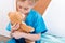 Girl nurse kissing teddy bear in hospital chamber