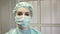 Girl nurse in the operating room in a medical mask