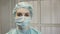 Girl nurse in the operating room in a medical mask