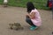 A girl nursing a ducklings