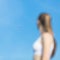 Girl observing airplane in sky