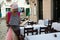 Girl observing menu at an empty restaurant