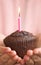 Girl offering a chocolate muffin