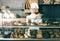 Girl offering desserts in the pastry shop