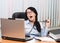 Girl at office behind a table