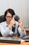 Girl at office behind a table