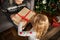 Girl open christmas gift with grandmother