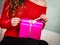 Girl opening present pink gift box