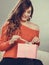 Girl opening present pink gift box