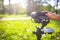 A girl operating camera mounted on a gimbal, focus on the gimbal and camera.