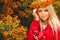 Girl in Orange wreath with Red Apple in hand