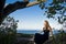 girl overlooking monterey bay under a tree