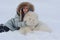 girl owner hugging white Samoyed dog