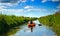 Girl with paddle and kayak