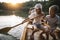 Girl paddling canoe on the lake with her brother and father in background