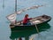 Girl paddling on an old sailing ship in Bermeo