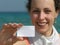 Girl with paper for text on beach