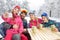 Girl with parents and brother making selfie at winter holiday