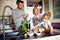 Girl with parents having breakfast