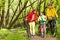 Girl with parents walking mounting biking trail