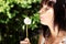 Girl in park with a dandelion