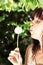 Girl in park with a dandelion