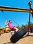 Girl on Park Tire Swing