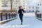 The girl participates in winter orienteering training in urban conditions