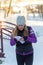 The girl participates in winter orienteering training in urban conditions